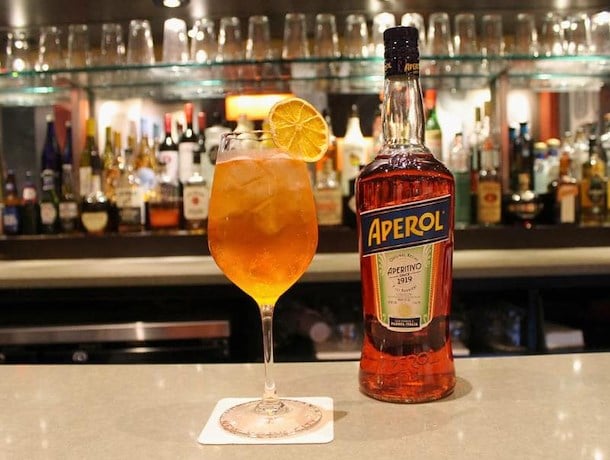 a drink and bottle on a counter
