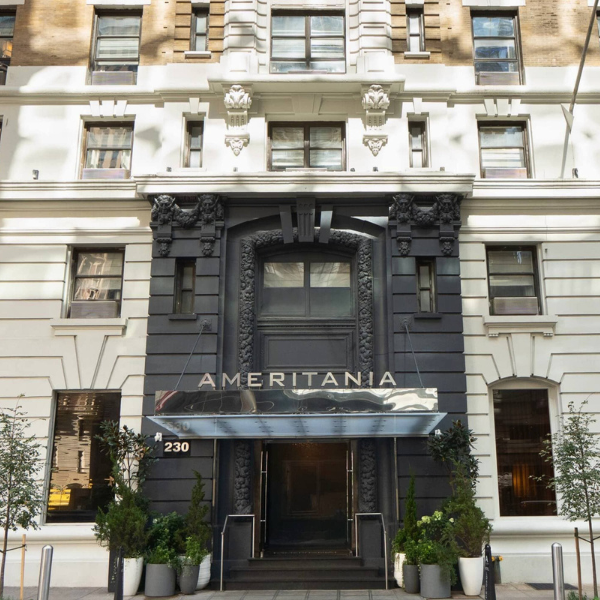 A photograph of the exterior of the Ameritania Hotel, showing its facade and entrance.